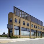 An exterior view of the PLICO Flatiron Building