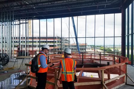 Alvine employees reviewing punch list items at the Eppley Airfield Parking Garage