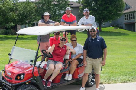 Alvine Engineering staff on a golf cart