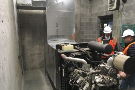 Alvine Engineering staff inspect mechanical equipment at 1201 Cass Street.