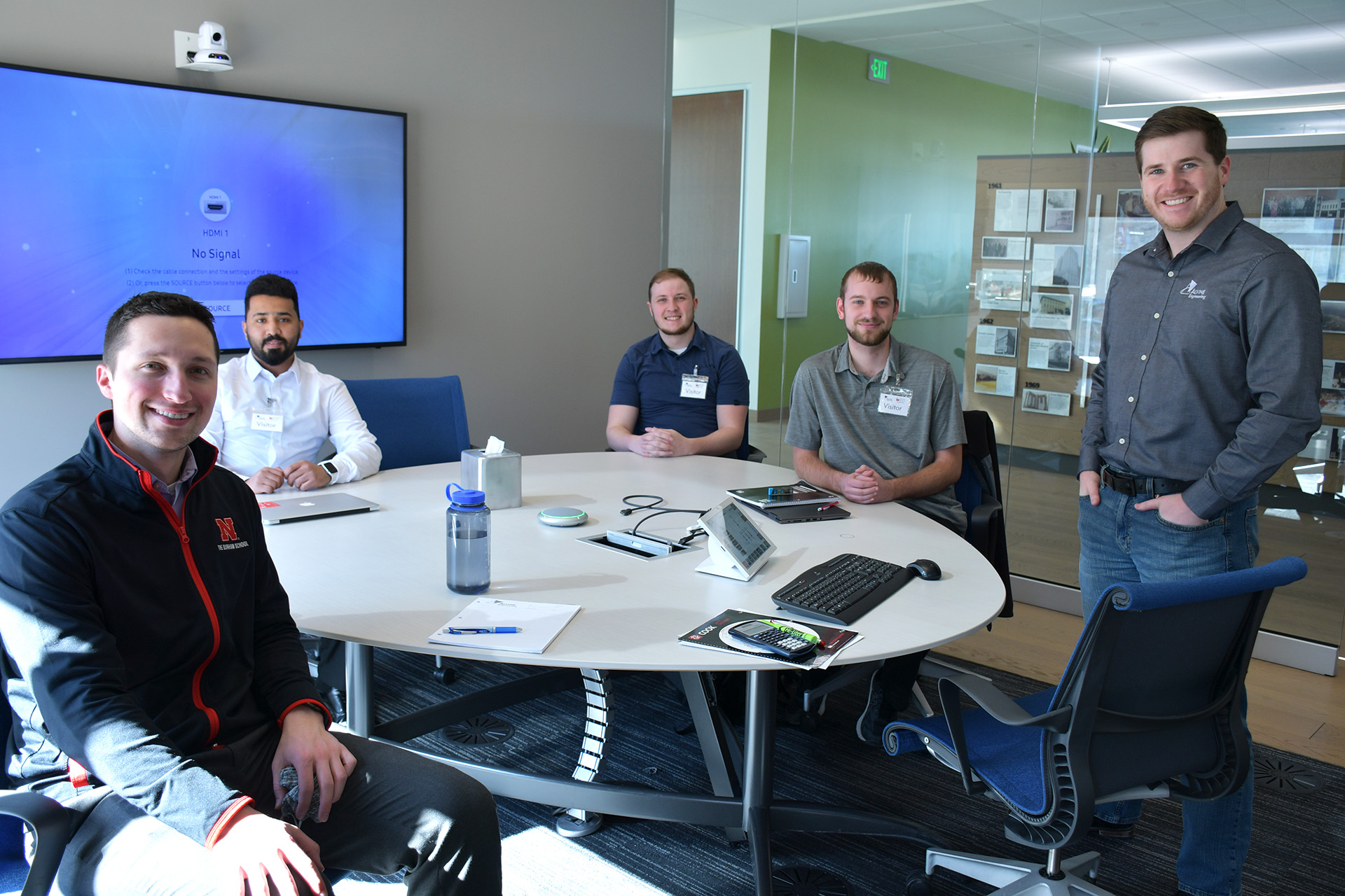 Alvine Engineering staff poses with the PKI students they mentor.