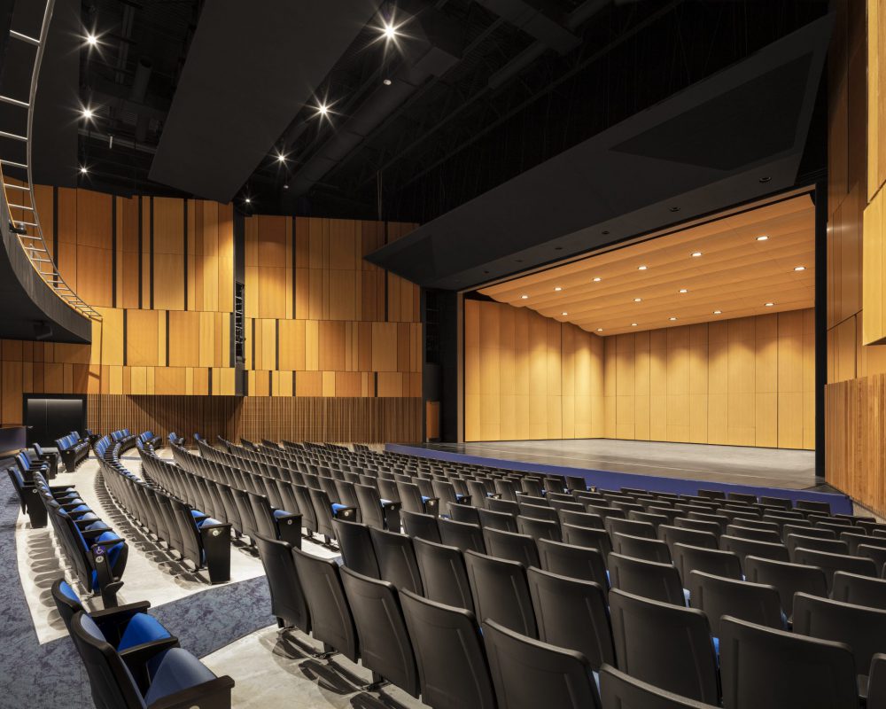 Floor seating facing stage right of the performing arts center.