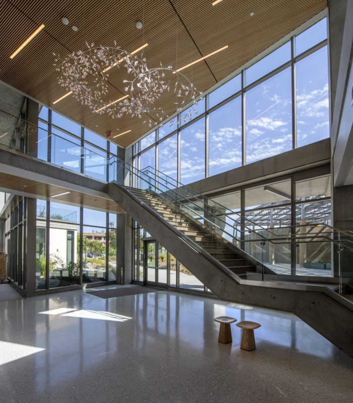 Interior shot of University of California, Irvine Susan and Henry Samueli College of Health Sciences' lobby area and staircase the second floor