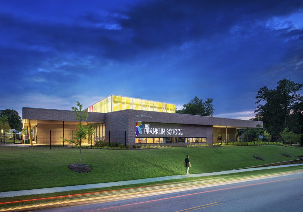 The Franklin School Early Learning Center in Spartanburg, South Carolina exterior shot of the building at dusk showing the lantern at the top of the building lit up